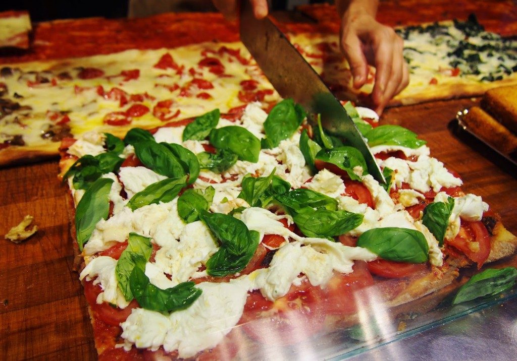 Take a bite off a square Pizza in Rome. Image Source: www.sankles.com