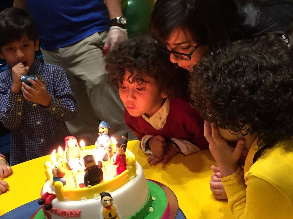 Writer Shireen with her son Eyan blowing out the candles.
