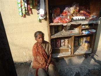 Chhaya Pawar owns a small grocery shop and has increased her stock with a Rang De loan. She supports the household with her income. Image Source: rangde.org