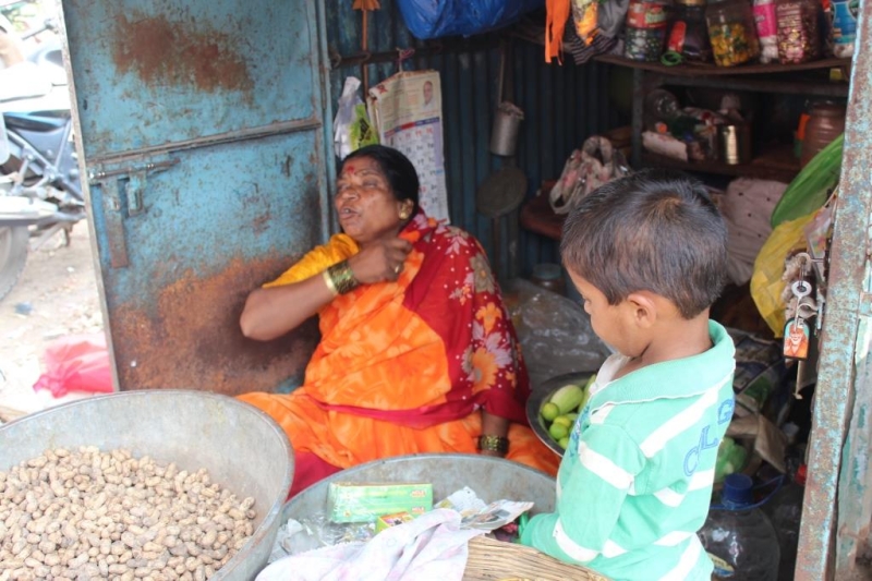 Sushila Tadake owns a small roadside shop. selling fruits, peanuts and grocery items. She recently paid her first installment of the loan.  Image Source: rangde.org
